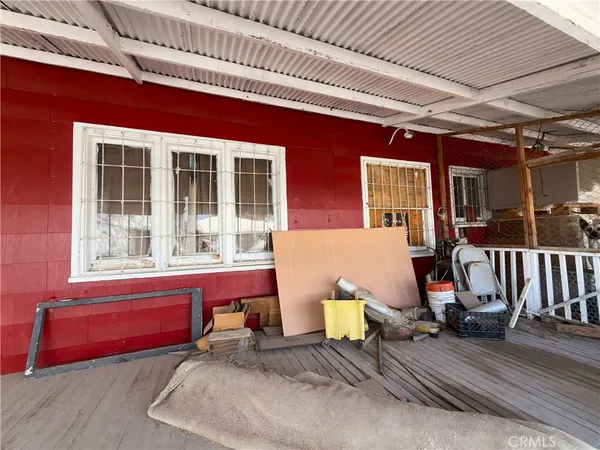 a view of a chairs and table in a patio