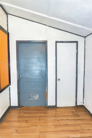 a view of a balcony with wooden fence