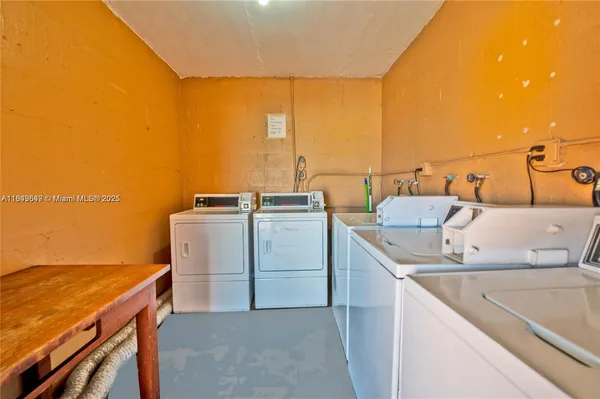a utility room with washer and dryer