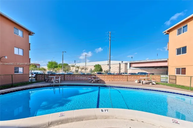 a view of a kitchen with kitchen island and a counter top space