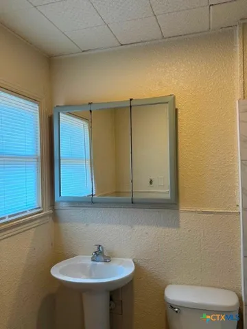 a bathroom with a bathtub and toilet