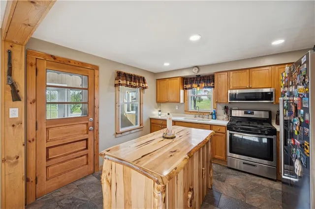 a kitchen that has a stove and a refrigerator