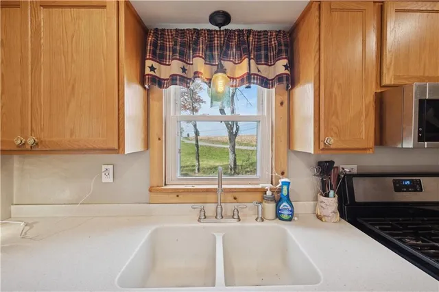 a kitchen with a sink and a window
