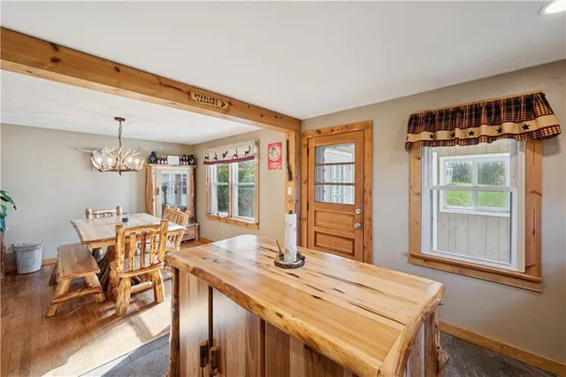 a view of a dining room with furniture window and outside view