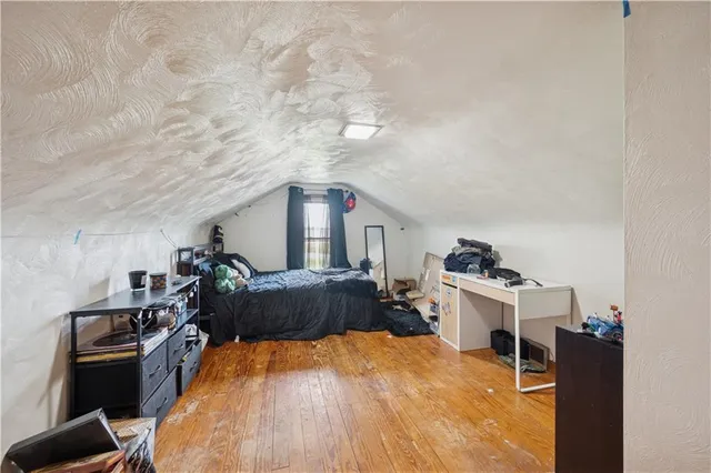 a bed room with a bed and a tv