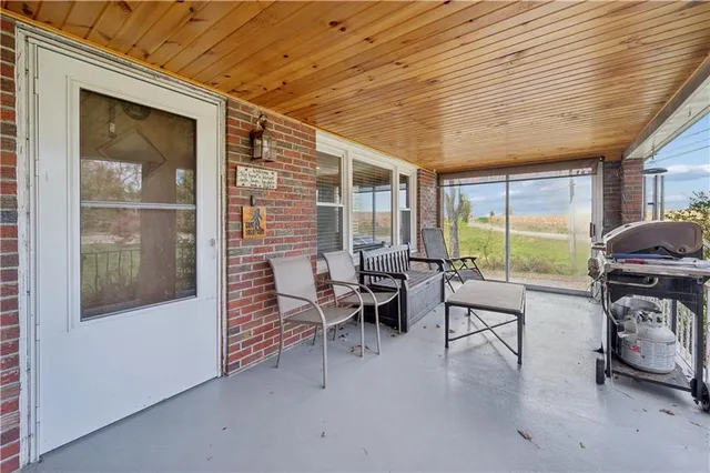 a living room with furniture a window and a table
