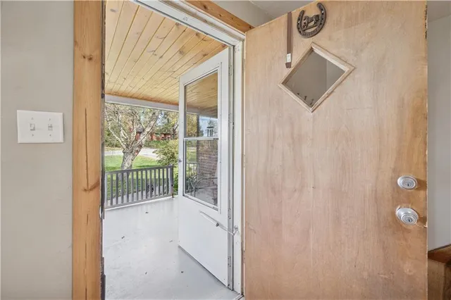 a view of a door and a window