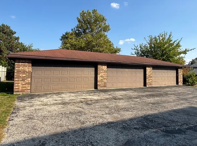 a front view of a house with a garage