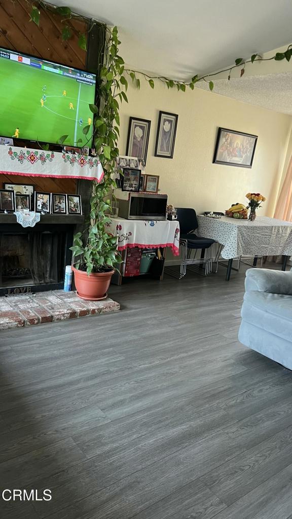 5215 Jefferson Square Oxnard, CA 93033 - Photo 5 of 12 a view of a living room with furniture and a fireplace
