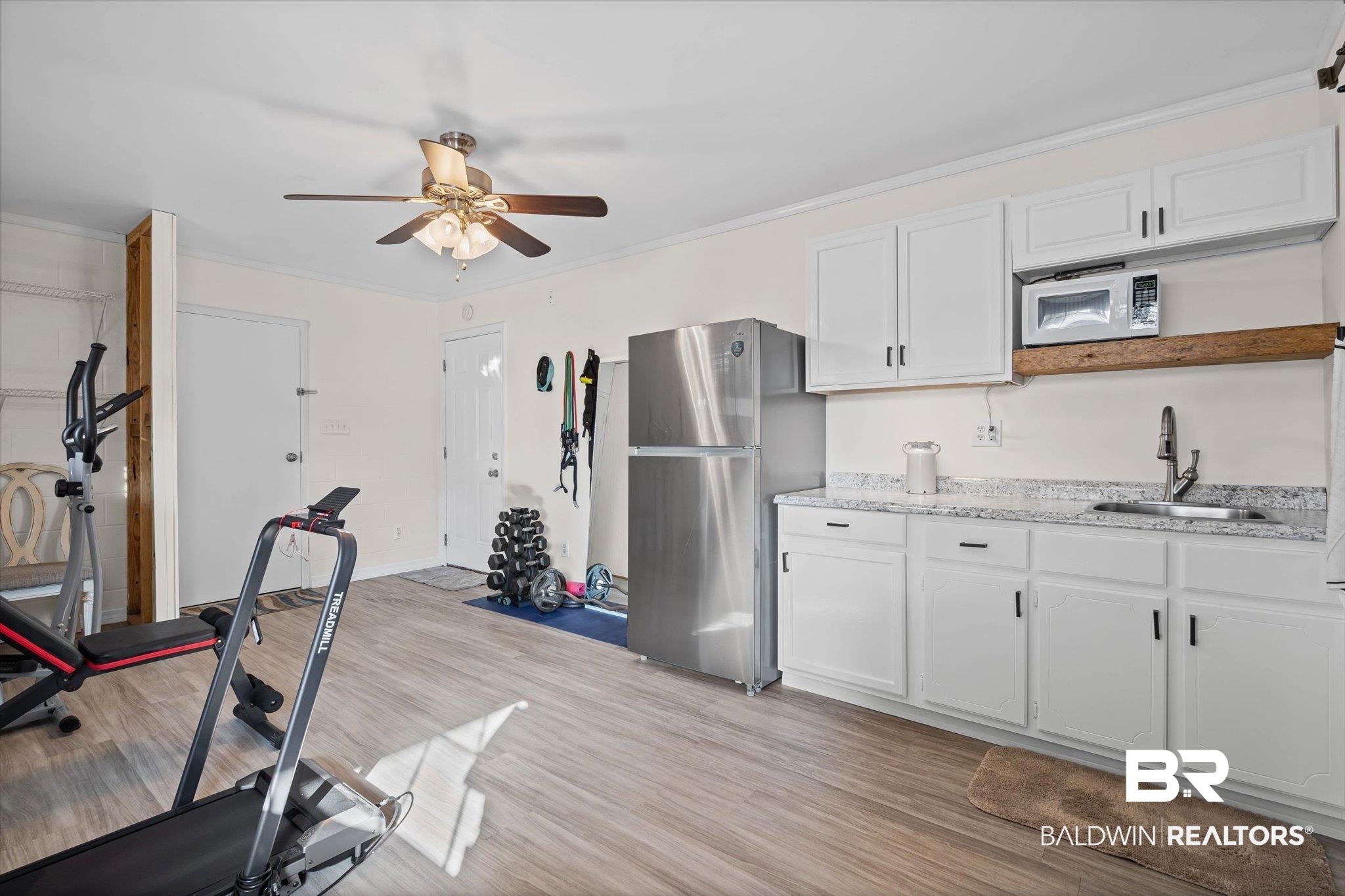 4567 Pine Avenue Saraland, AL 36571 - Photo 36 of 48 Workout room with ornamental molding, light wood-style flooring, and ceiling fan