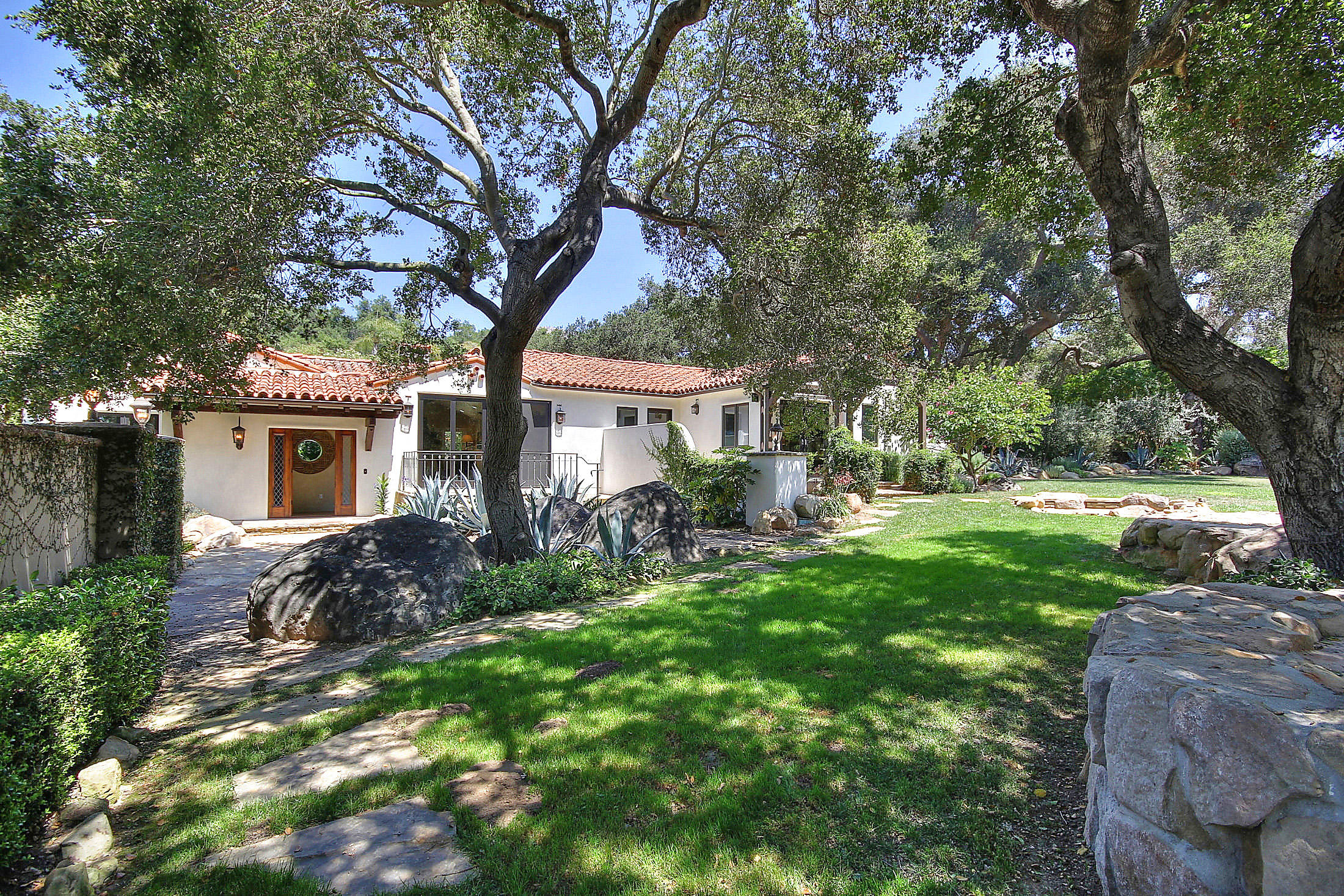 2540 Foothill Road Santa Barbara, CA 93105 - Photo 1 of 45 a front view of a house with garden