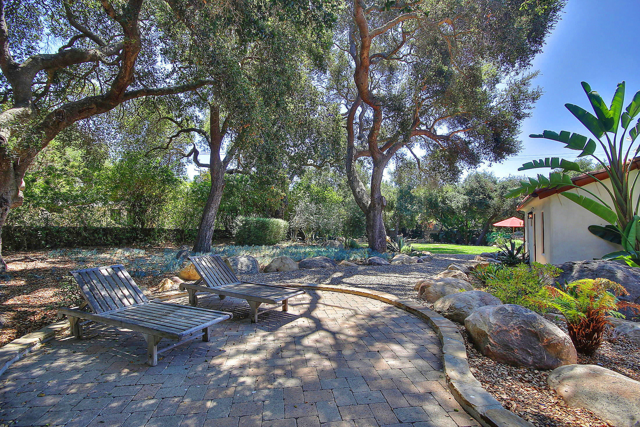 2540 Foothill Road Santa Barbara, CA 93105 - Photo 12 of 45 a view of a lake with a bench and some trees