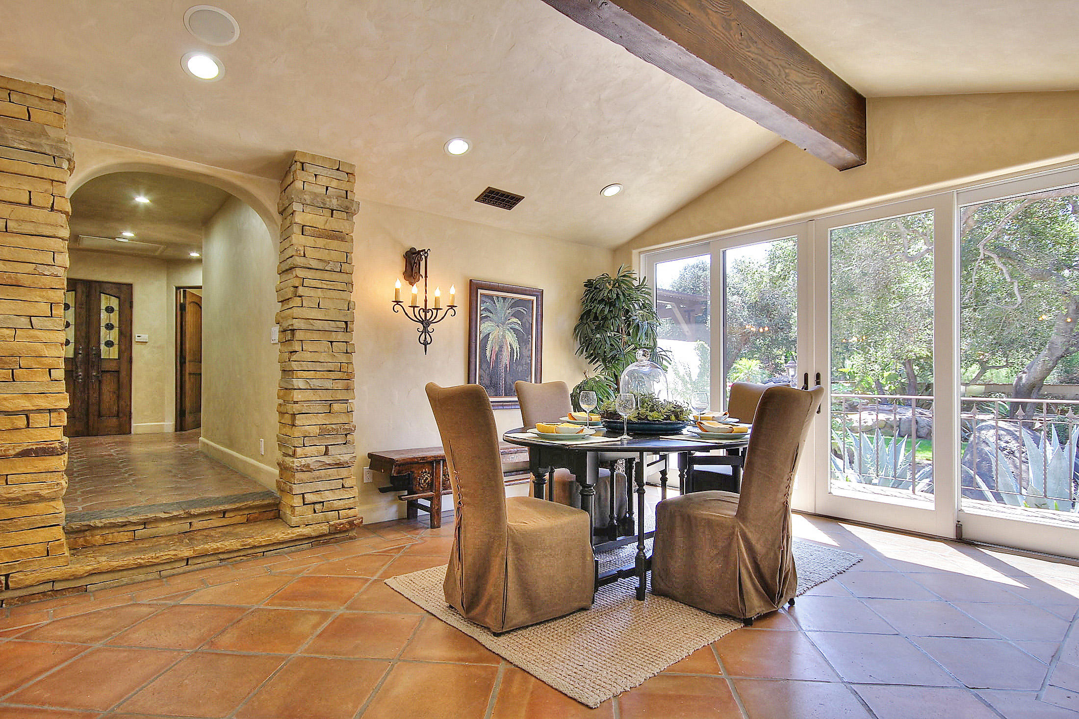 2540 Foothill Road Santa Barbara, CA 93105 - Photo 21 of 45 a view of a dining room with furniture and chandelier