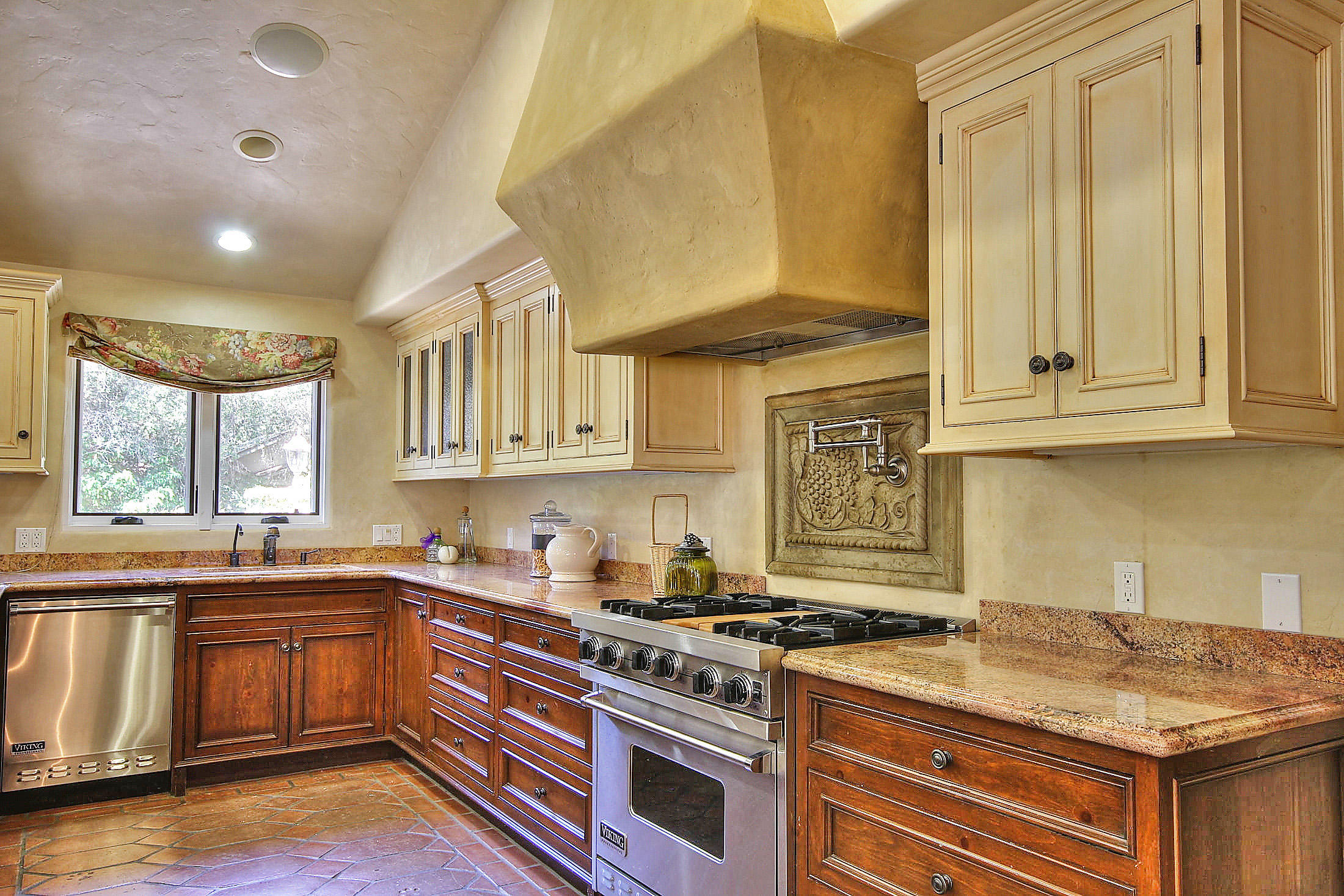 2540 Foothill Road Santa Barbara, CA 93105 - Photo 24 of 45 a kitchen with granite countertop a stove sink and cabinets