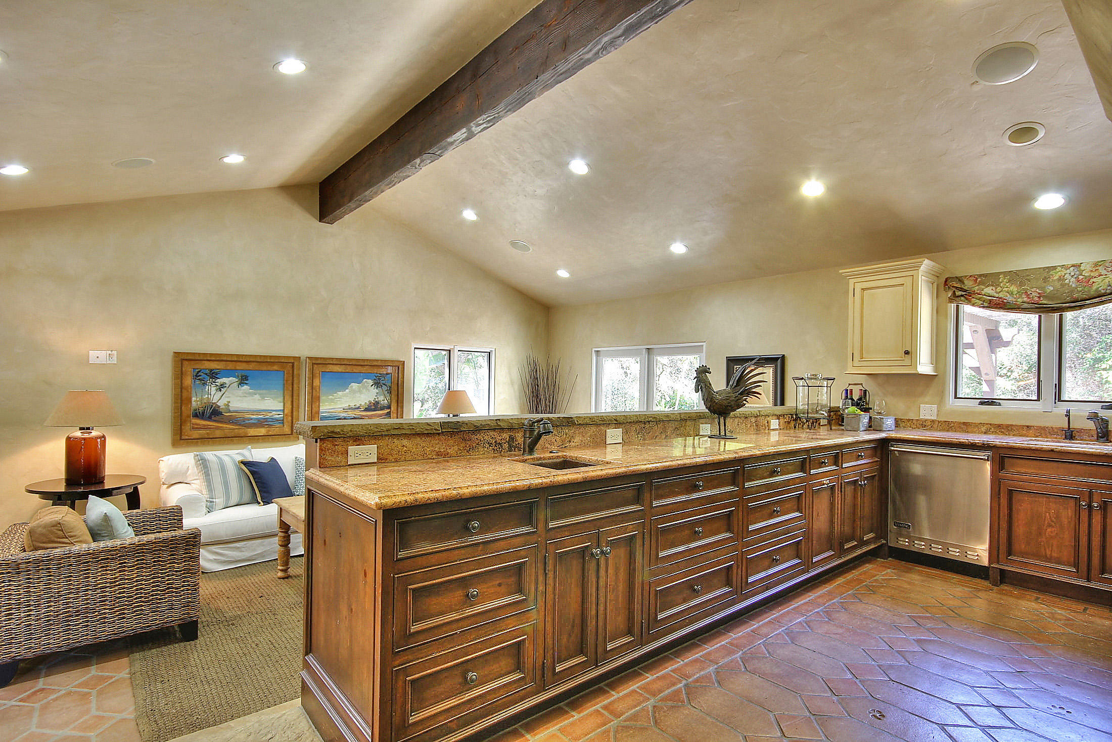 2540 Foothill Road Santa Barbara, CA 93105 - Photo 25 of 45 a kitchen with stainless steel appliances granite countertop living room and couches