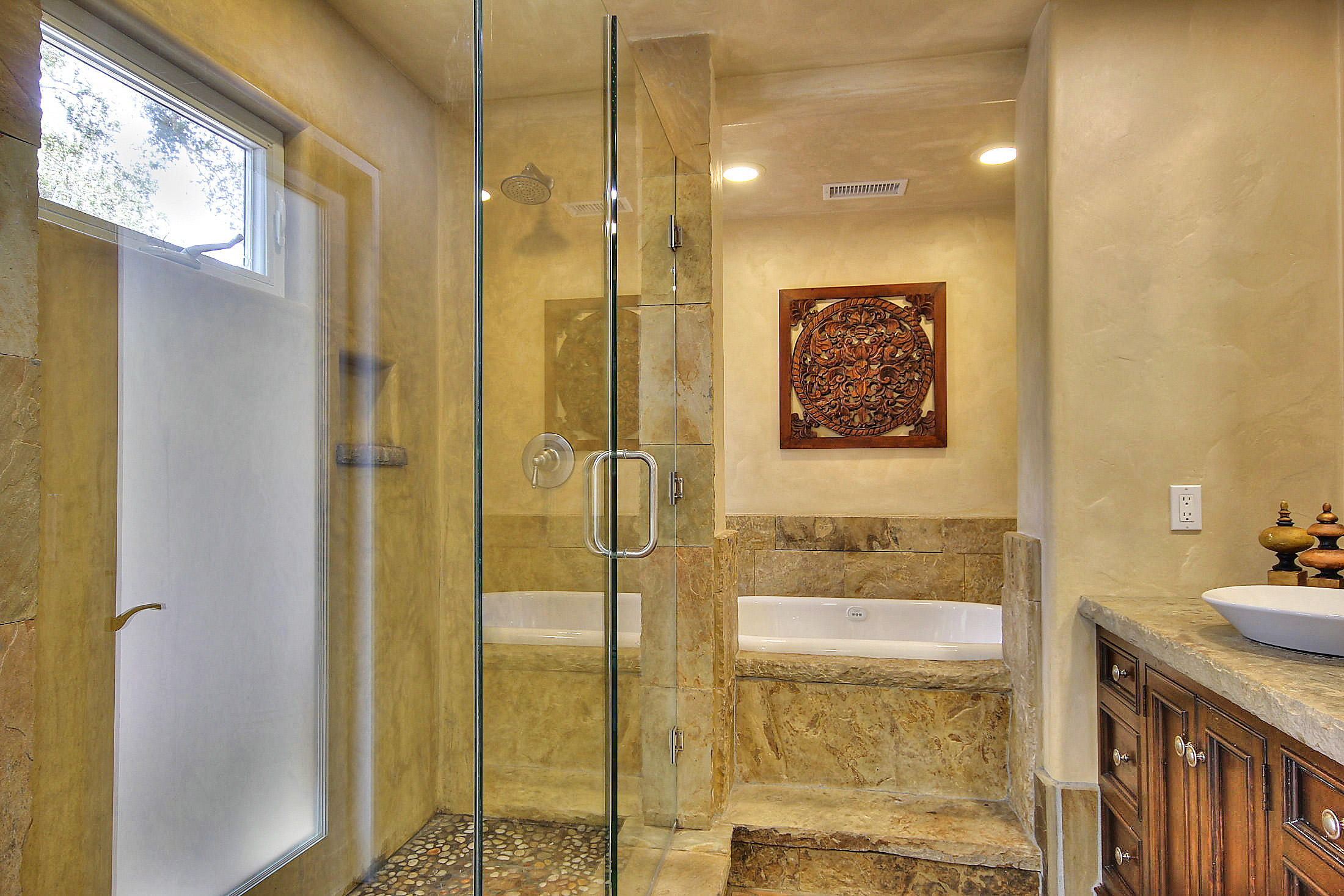 2540 Foothill Road Santa Barbara, CA 93105 - Photo 33 of 45 a bathroom with a granite countertop shower a sink and a mirror