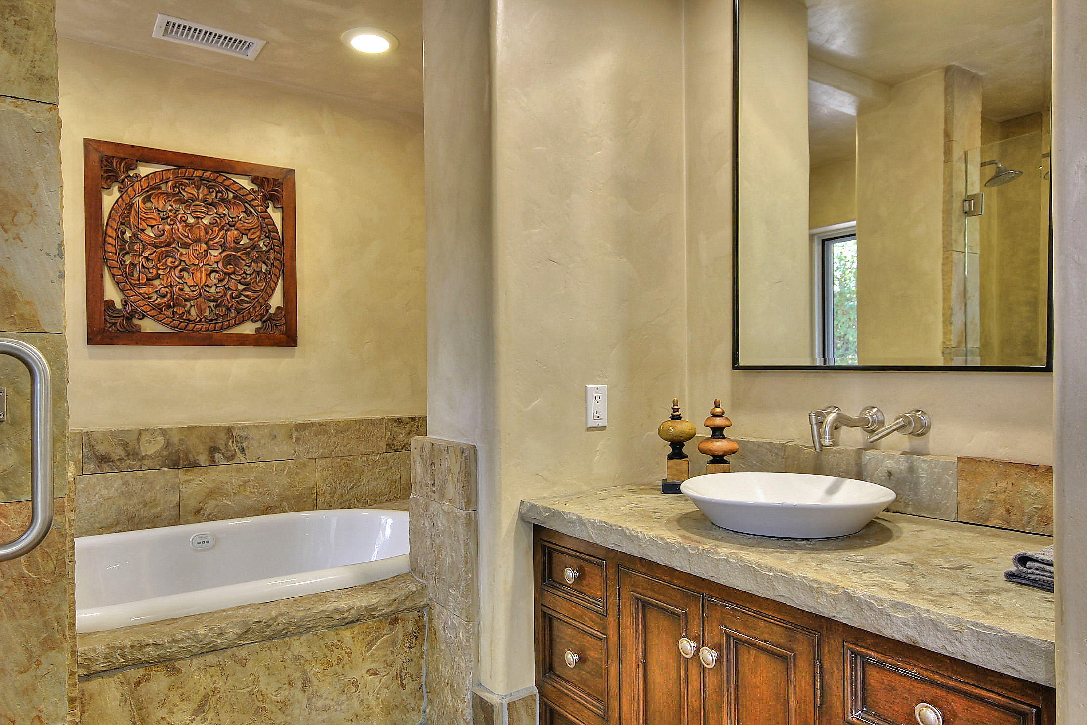 2540 Foothill Road Santa Barbara, CA 93105 - Photo 34 of 45 a bathroom with a granite countertop sink and a mirror