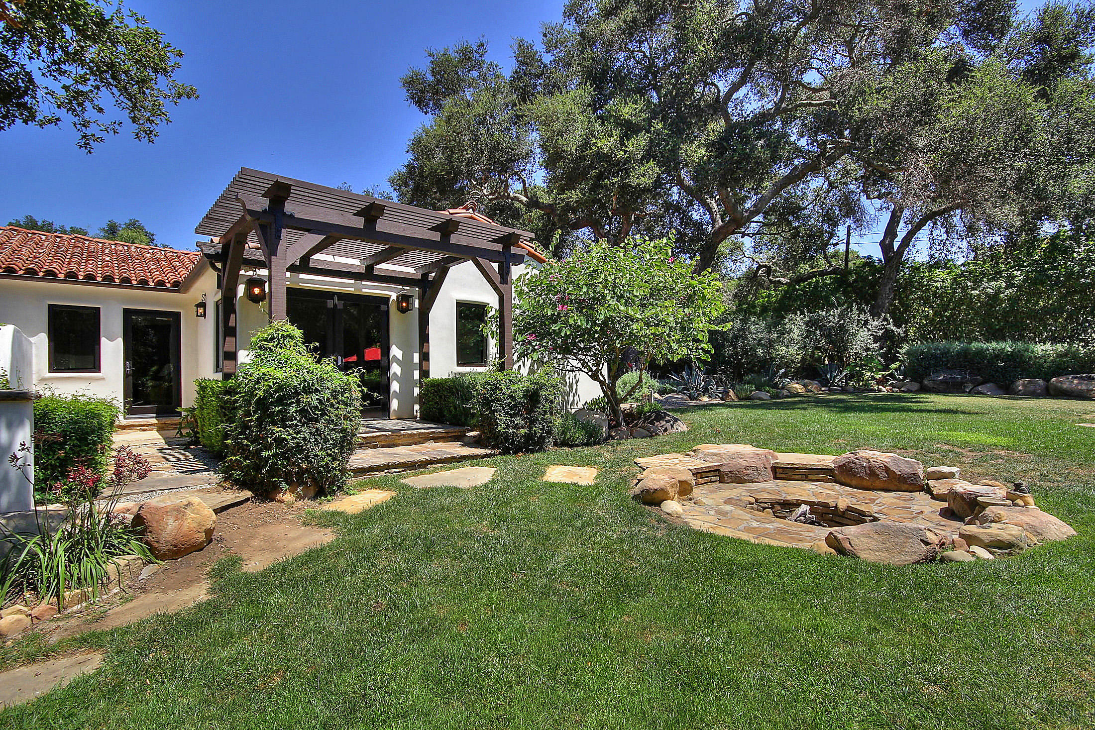 2540 Foothill Road Santa Barbara, CA 93105 - Photo 9 of 45 a front view of a house with garden