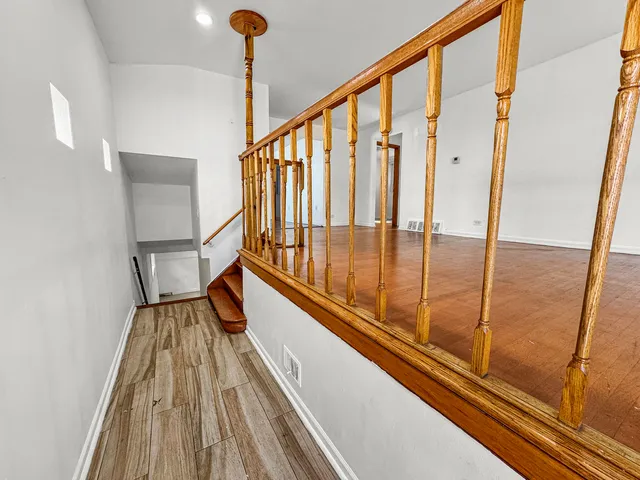 a view of balcony with wooden floor