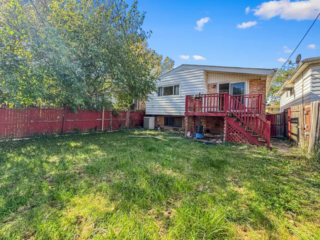 a view of a house with a back yard