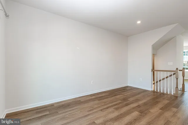 a view of a room with wooden floor
