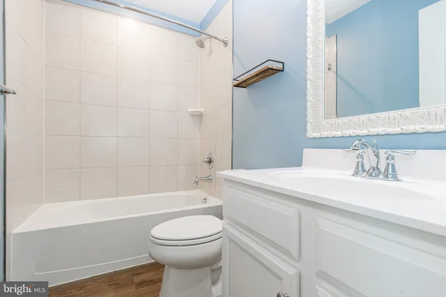 a bathroom with a sink a toilet and a bathtub