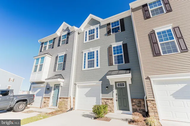 a front view of a building with many windows
