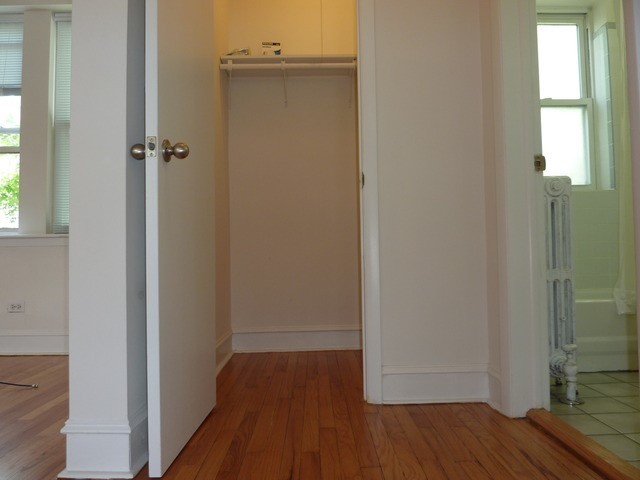 5058 North Claremont Avenue, Unit 2E Chicago, IL 60625 - Photo 10 of 12 a view of a hallway with wooden floor