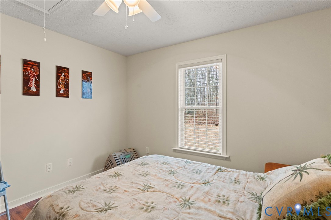388 Berry Ridge Road Tappahannock, VA 22560 - Photo 14 of 25 a bedroom with a bed and a window
