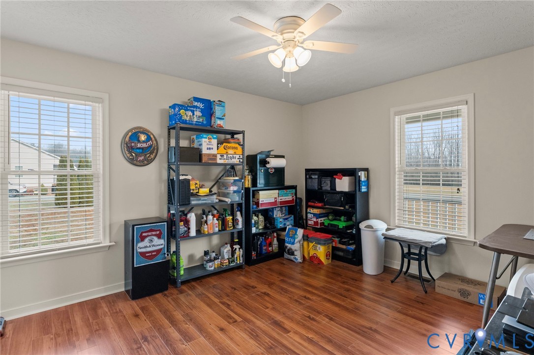 388 Berry Ridge Road Tappahannock, VA 22560 - Photo 15 of 25 a view of a workspace with furniture and a window