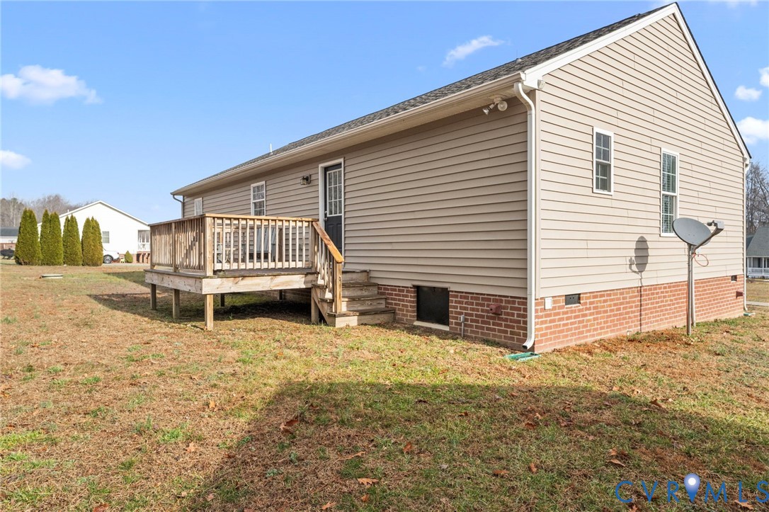 388 Berry Ridge Road Tappahannock, VA 22560 - Photo 18 of 25 a view of a house with a backyard