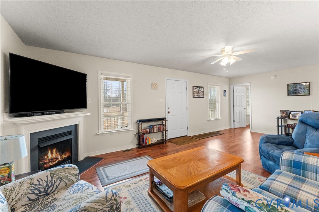 388 Berry Ridge Road Tappahannock, VA 22560 - Photo 5 of 25 a living room with furniture fireplace and flat screen tv