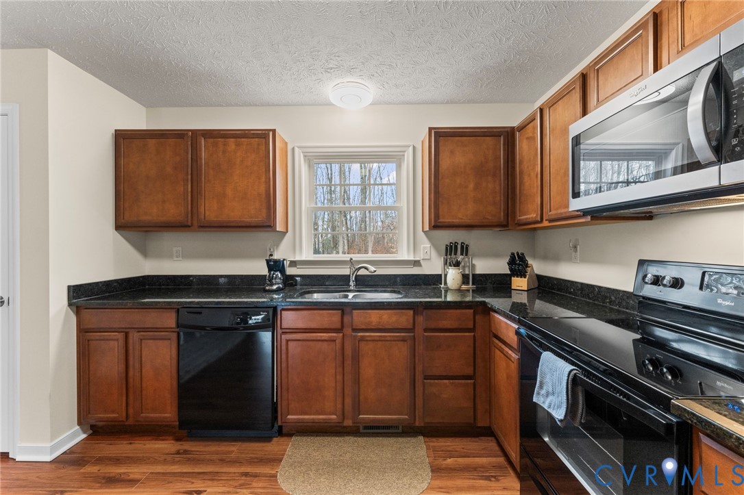 388 Berry Ridge Road Tappahannock, VA 22560 - Photo 8 of 25 a kitchen with a stove and a sink