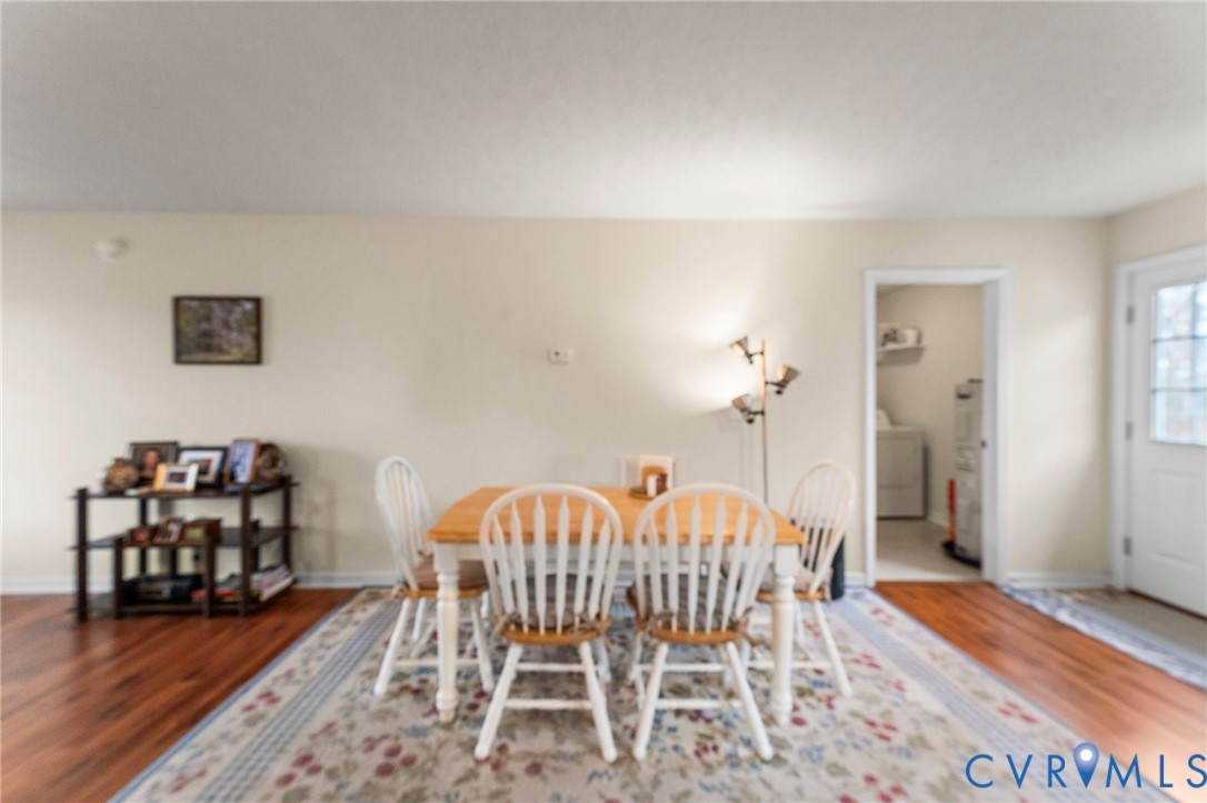 388 Berry Ridge Road Tappahannock, VA 22560 - Photo 9 of 25 a bedroom with furniture and a wooden floor