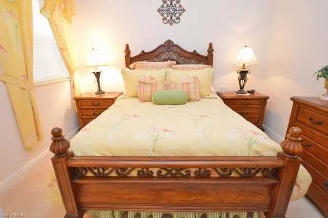 a bathroom with a toilet a sink a mirror and a shower