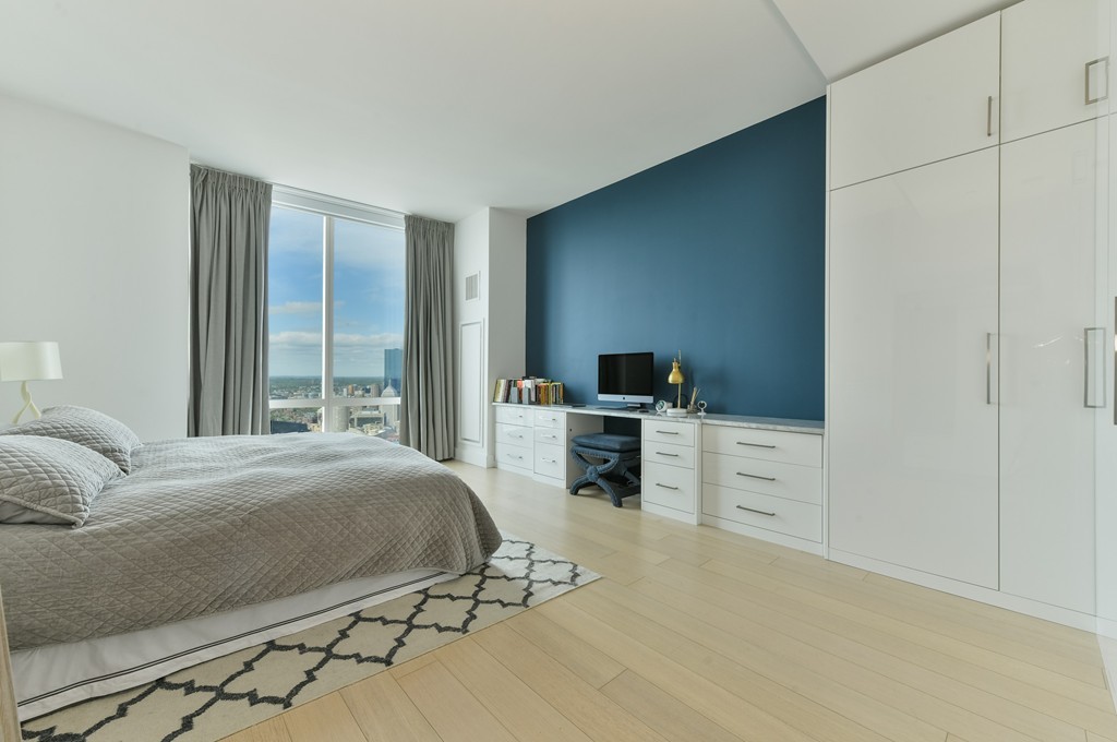 1 Franklin Street, Unit 5201 Boston, MA 02110 - Photo 20 of 23 a bedroom with a bed and furniture