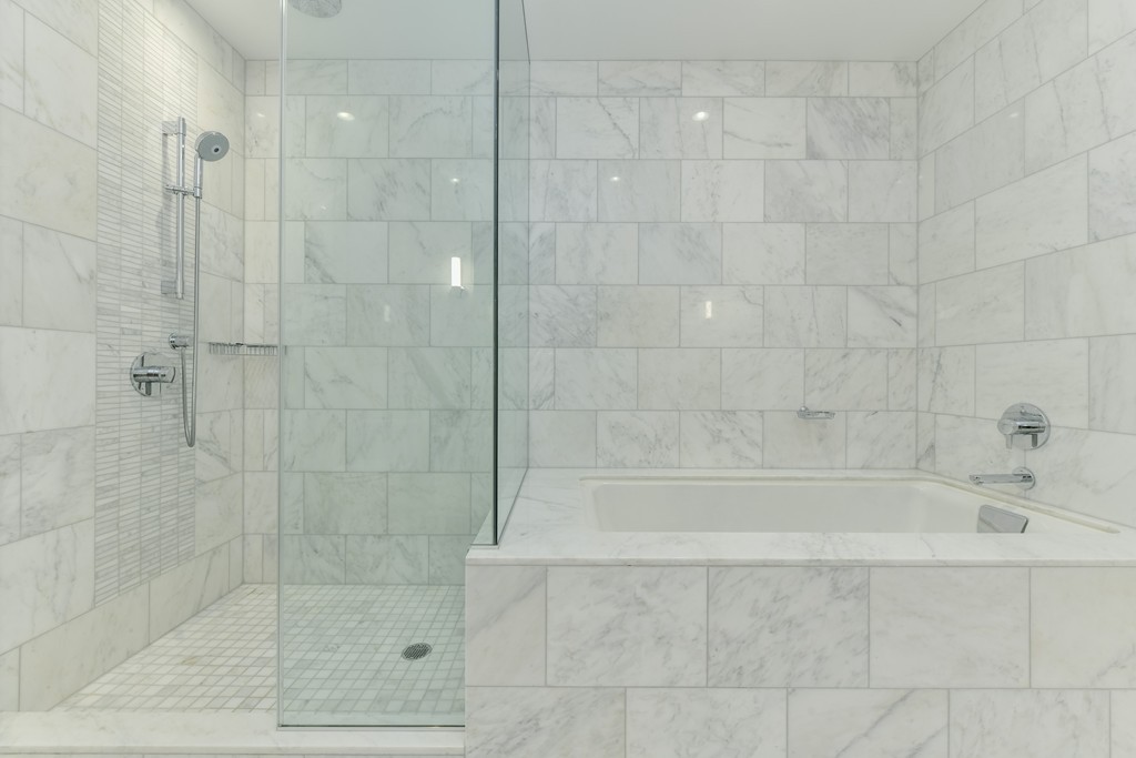 1 Franklin Street, Unit 5201 Boston, MA 02110 - Photo 22 of 23 a bathroom with a shower and a bathtub