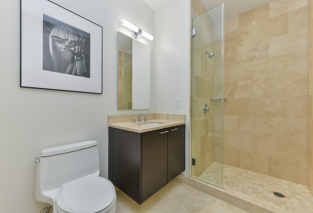 1 Franklin Street, Unit 5201 Boston, MA 02110 - Photo 6 of 23 a bathroom with a sink toilet and shower