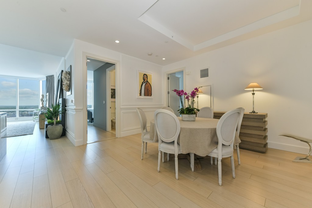 1 Franklin Street, Unit 5201 Boston, MA 02110 - Photo 9 of 23 a view of a dining room with furniture and wooden floor