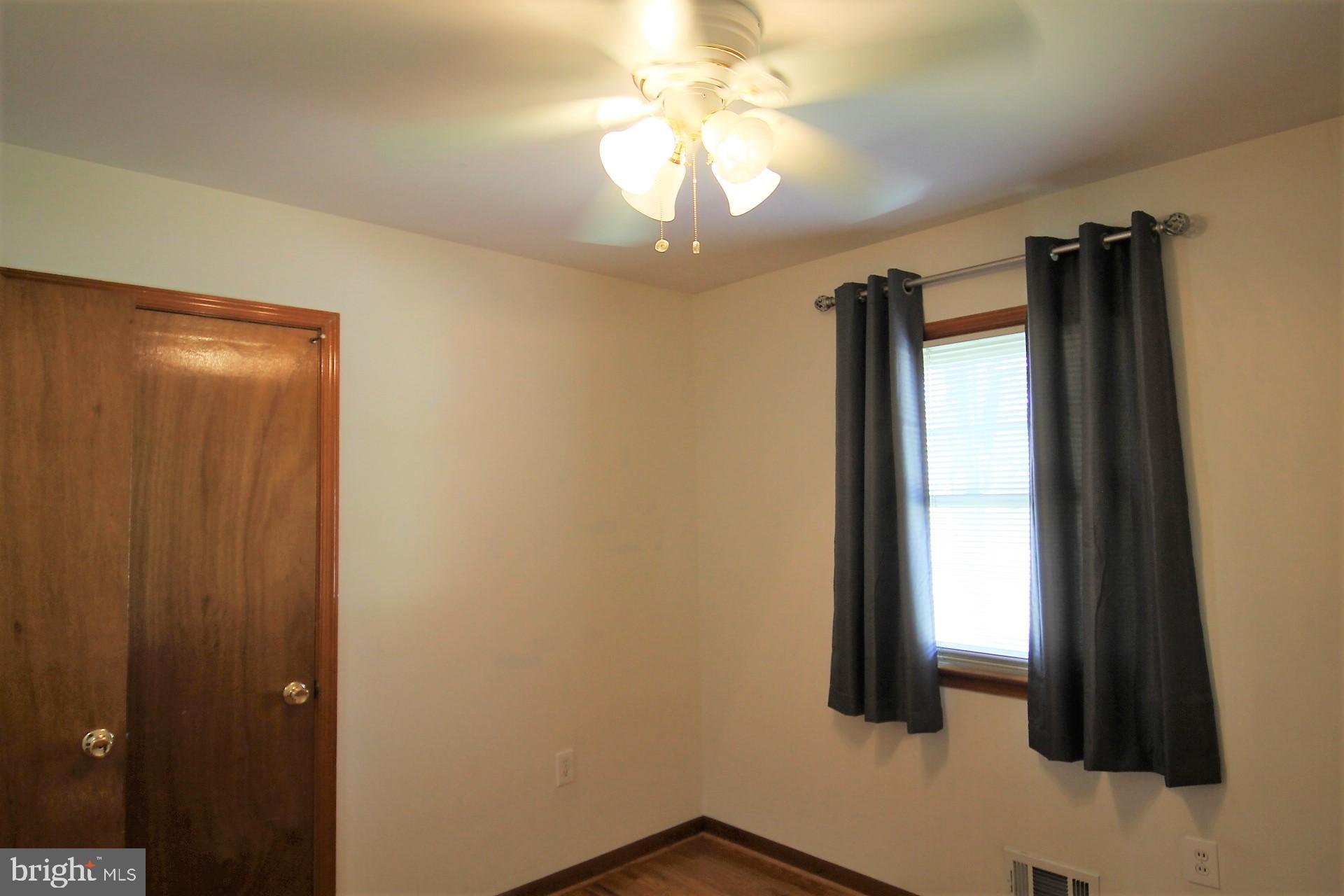 213 Magothy Beach Road Pasadena, MD 21122 - Photo 17 of 39 Bedroom Two w Ceiling Fan and Double Closet Doors
