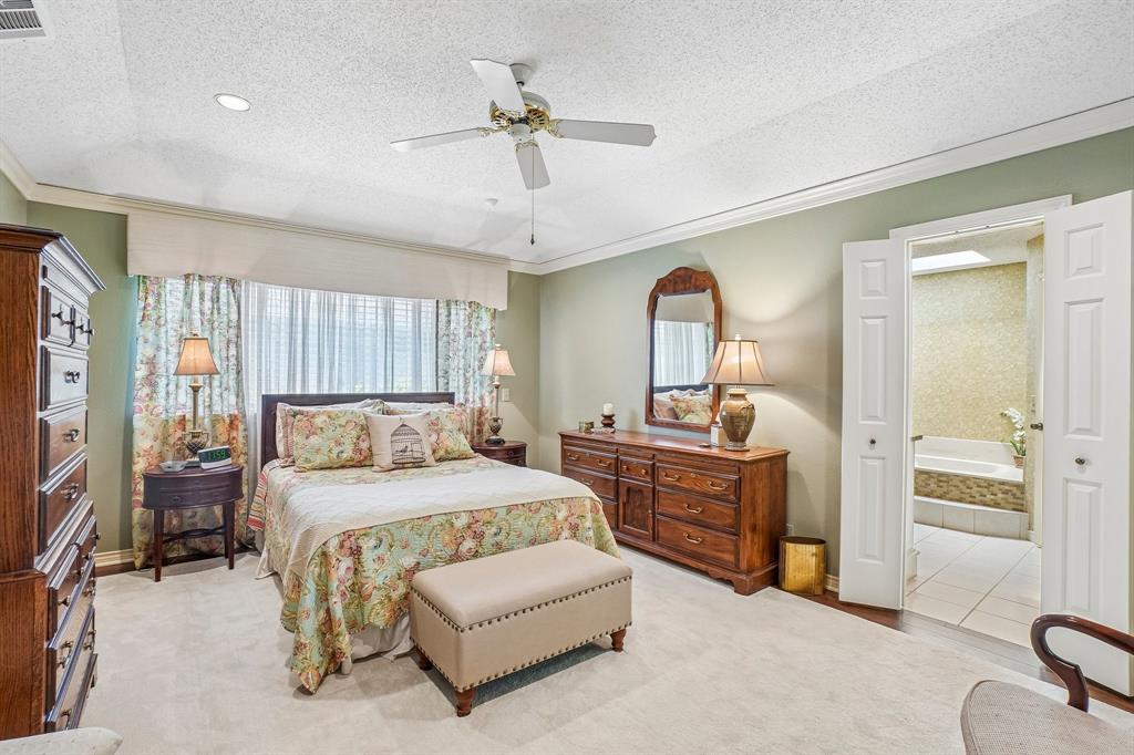 12929 Jasoncrest Trail Dallas, TX 75243 - Photo 20 of 38 Carpeted bedroom featuring a ceiling fan, recessed lighting, and a wide window opening