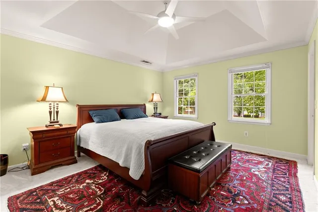 a bedroom with a bed and a lamp