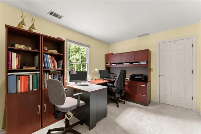 a bathroom with a double vanity sink toilet and a mirror