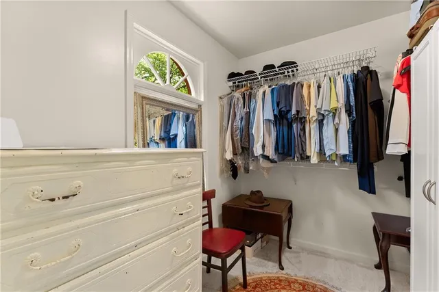 a bathroom with a shower curtain and a toilet