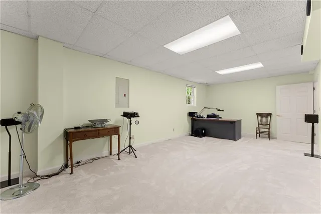 a view of a backyard with sitting area and potted plants