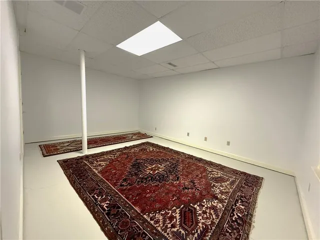 a view of a house with a backyard and a deck