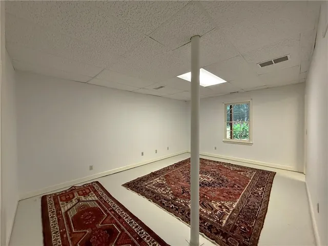 a view of an chairs and table in backyard