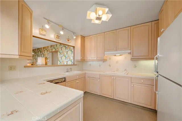 a room with lots of furniture and white walls