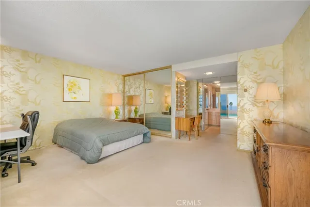 a bathroom with a sink vanity mirror and toilet