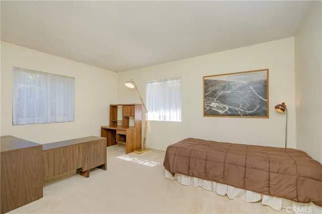 a bathroom with a sink mirror vanity and toilet